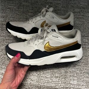 Nike Air Women's Gold and Black Sneakers